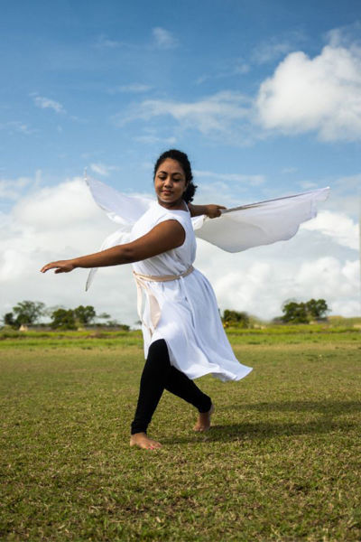 praise dancer spinning with flowing white praise dress